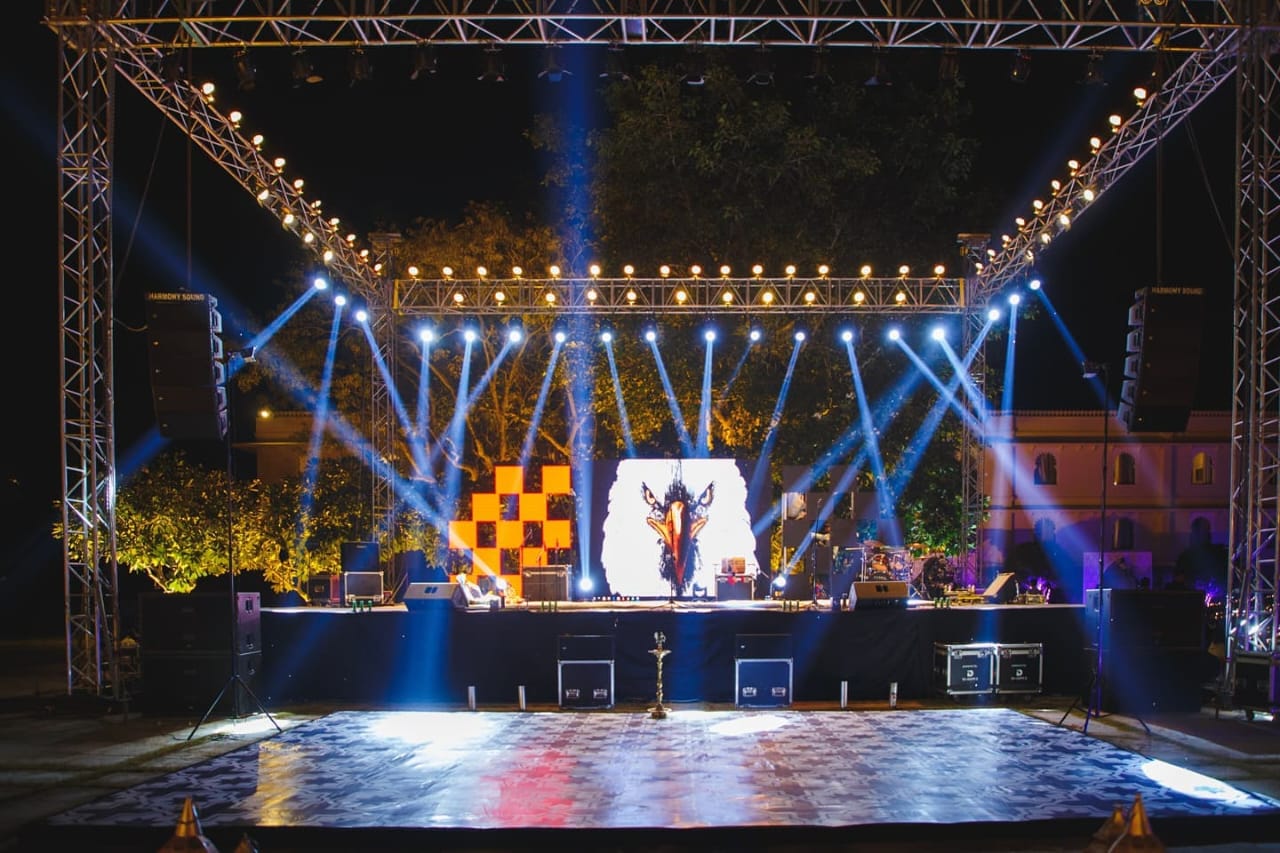 Illuminated outdoor stage and dance floor at night