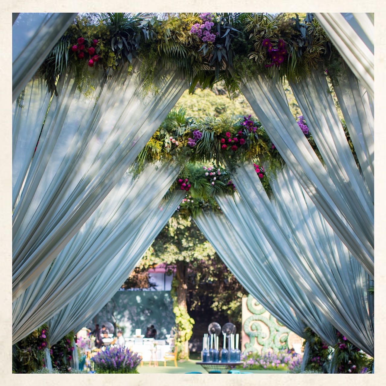 Draped floral archway pathway